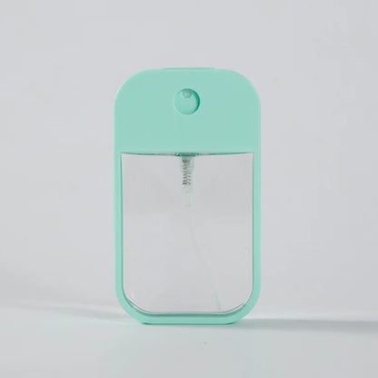 Portable 45ml square perfume spray bottle by BackupMyFilesNow.com, refillable silicone travel atomizer for perfume or sanitizer.