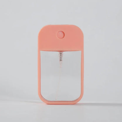 Portable 45ml square perfume spray bottle by BackupMyFilesNow.com, refillable silicone atomizer for travel and hand sanitizer use