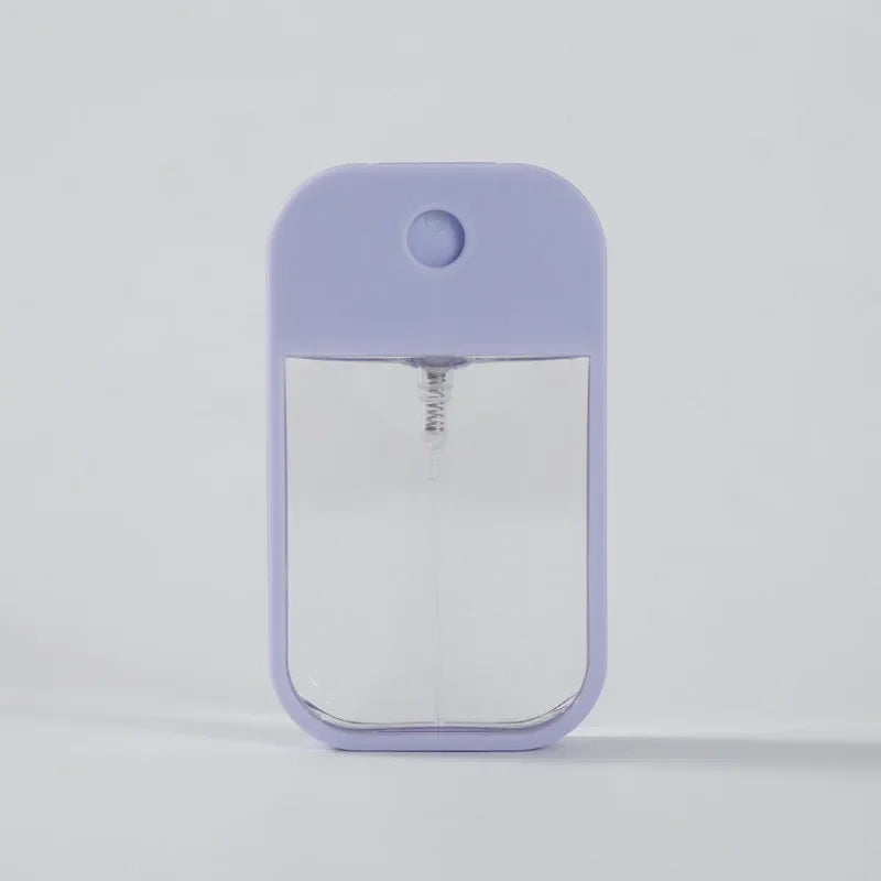 Portable square perfume spray bottle 45ml by BackupMyFilesNow.com, refillable silicone atomizer for travel and hand sanitizer.