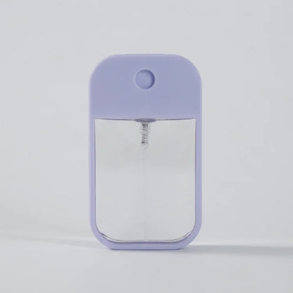 Portable square perfume spray bottle 45ml by BackupMyFilesNow.com, refillable silicone atomizer for travel and hand sanitizer.