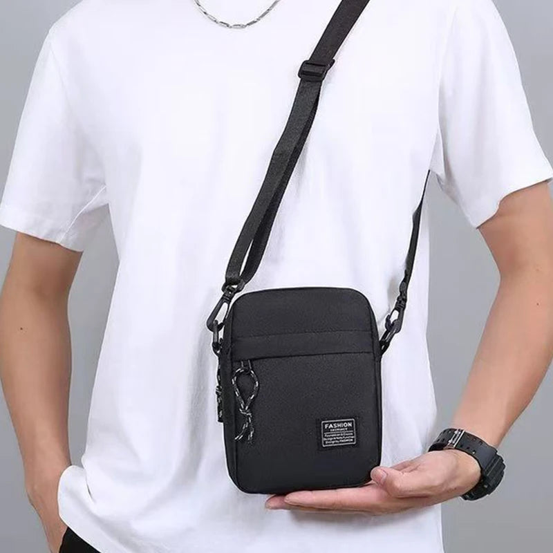 Black men's nylon bag with single shoulder or cross-body strap, ideal for daily school use, by BackupMyFilesNow.com