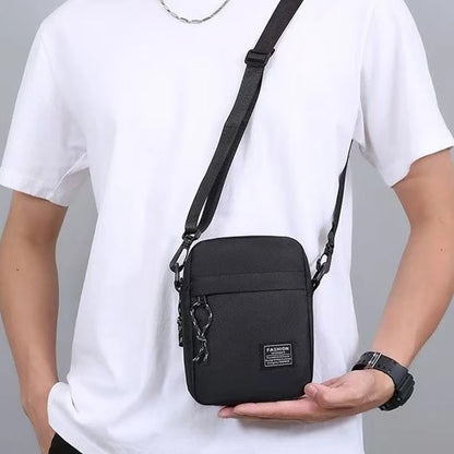 Black men's nylon bag with single shoulder or cross-body strap, ideal for daily school use, by BackupMyFilesNow.com