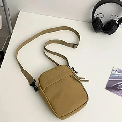 Black men's nylon bag from BackupMyFilesNow.com, available as single shoulder or cross-body, ideal for daily school use.
