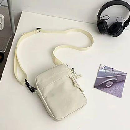 Black men's nylon bag with single shoulder or cross-body strap, ideal for daily school use, by BackupMyFilesNow.com