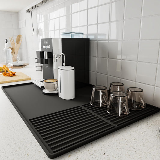 Black silicone coffee mat with raised edges, 24x16 inches, designed for countertops and coffee bar accessories under coffee makers
