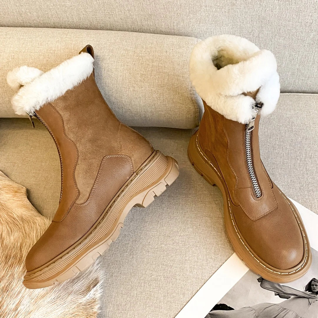 Black women's genuine leather patchwork winter ankle snow boots with front zipper, thick sole, platform, and rugged clod weather design.