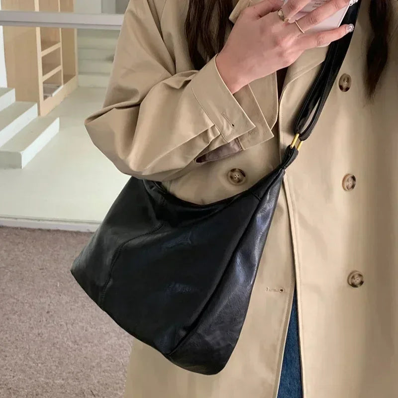 Black 2025 women’s soft PU leather foldable slouchy tote bag with zipper, stylish crossbody purse, vintage design, and spacious interior.