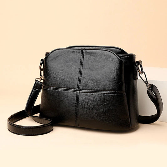 Vintage women's black PU leather shoulder bag with square shape, solid color, crossbody style, suitable for middle-aged women.