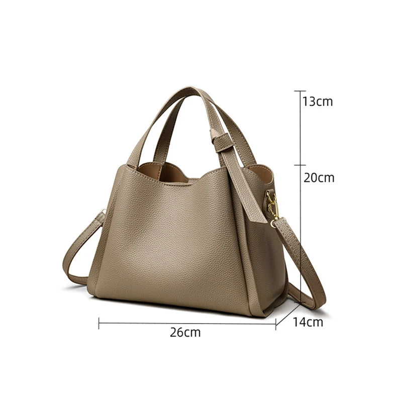 Black women's shoulder bag with retro style, large capacity, simple design, and portable messenger bucket shape.