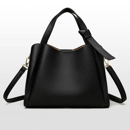 Black women's retro fashion shoulder handbag with simple texture, large capacity, and portable messenger bucket style.