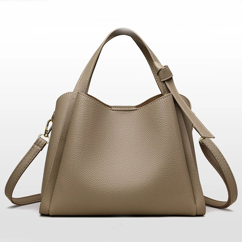 Black women's retro fashion shoulder bag with large capacity, simple design, textured surface, and portable messenger style.
