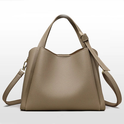 Black women's retro fashion shoulder bag with large capacity, simple design, textured surface, and portable messenger style.