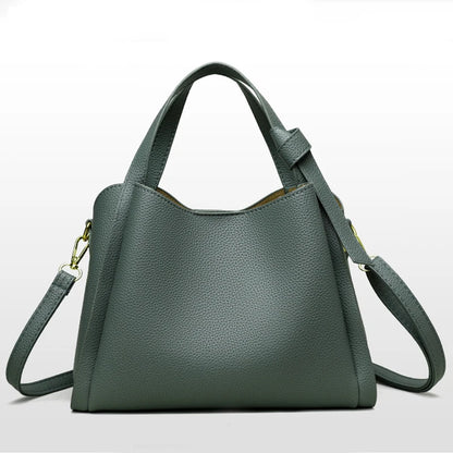 Black women's shoulder handbag with retro style, large capacity, simple design, textured surface, portable messenger bucket bag.