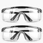 Two pairs of black safety goggles from BACKUPMYFILESNOW.COM® with anti-splash, dust-proof, and wind-resistant protective lenses for industrial use.