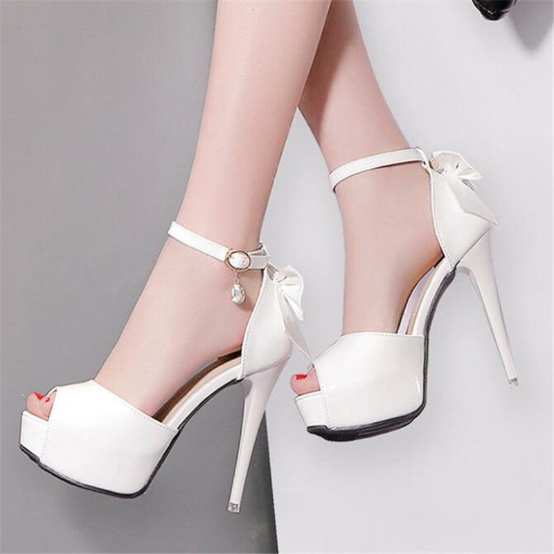 12cm stiletto heels with bow detail and open toe design by BACKUPMYFILESNOW.COM® shown on a model