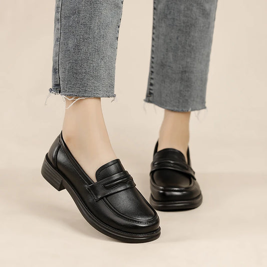 Black women's casual loafers by BackupMyFilesNow.com, slip-on leather flats with lightweight design and classic penny loafer style.