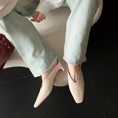 Black genuine leather women’s mules with square toe, chunky heel, and soft sandal design for summer and spring wear.