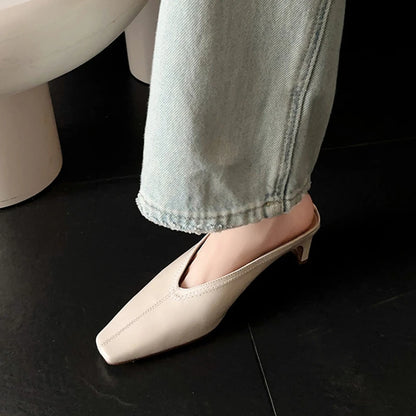Black genuine leather women's mules with square toe and chunky heel, spring/summer sandals with soft, comfortable design.