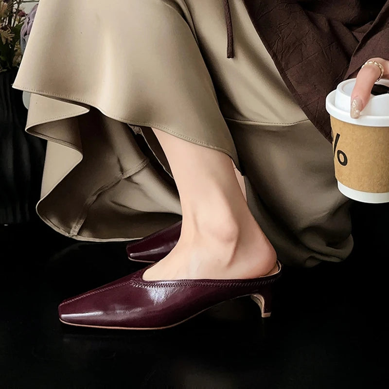Black genuine leather women’s mules with square toe and chunky heel, soft summer/spring slip-on sandals.