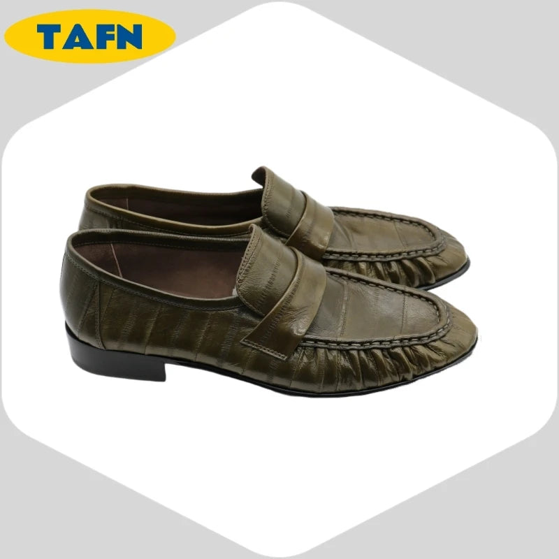 Black slip-on loafers by BackupMyFilesNow.com, stylish flat shoes with a sleek, simple design and comfortable fit.