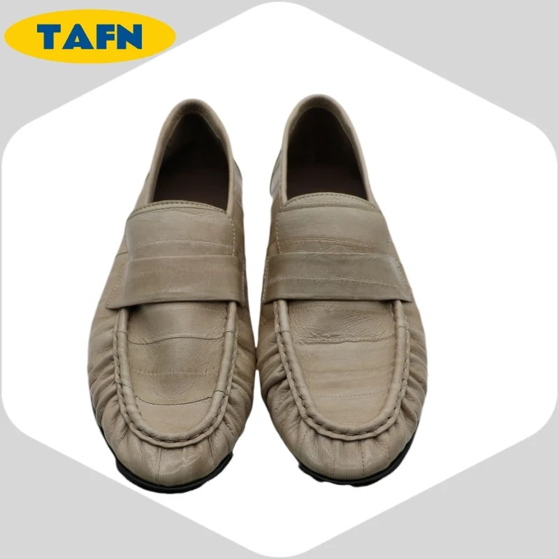 Black slip-on loafers from BackupMyFilesNow.com featuring a trendy, comfortable, and simple flat shoe design for all-day wear.
