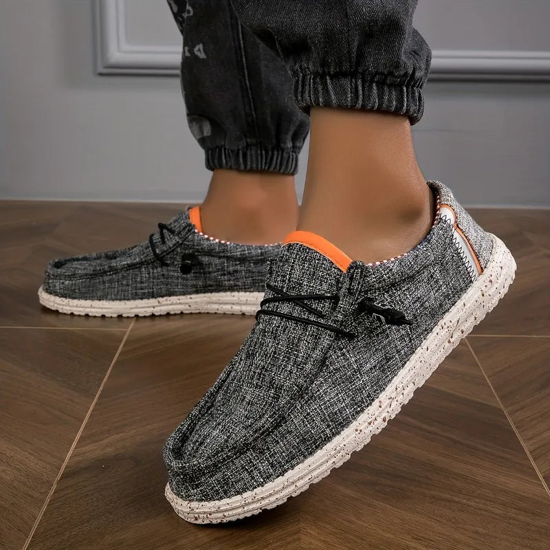 Black men's canvas loafers from BackupMyFilesNow.com, comfortable breathable casual driving vulcanized flat walking shoes.
