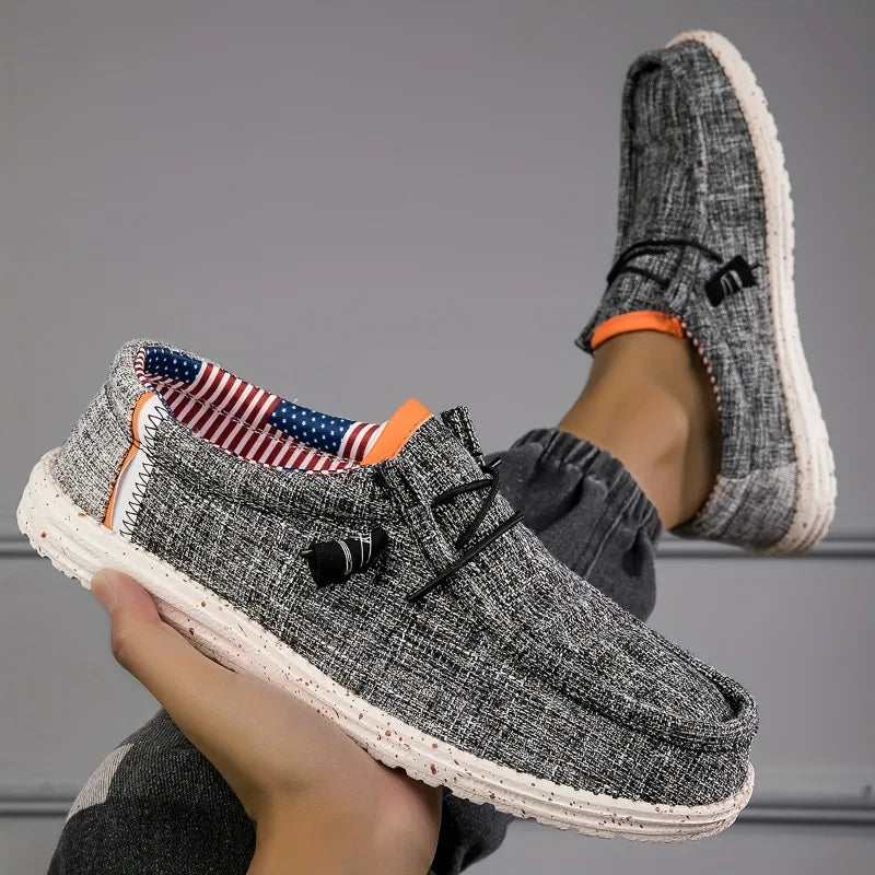 Black men's canvas loafers, breathable casual shoes ideal for walking and driving, featuring vulcanized flat sole for comfort.
