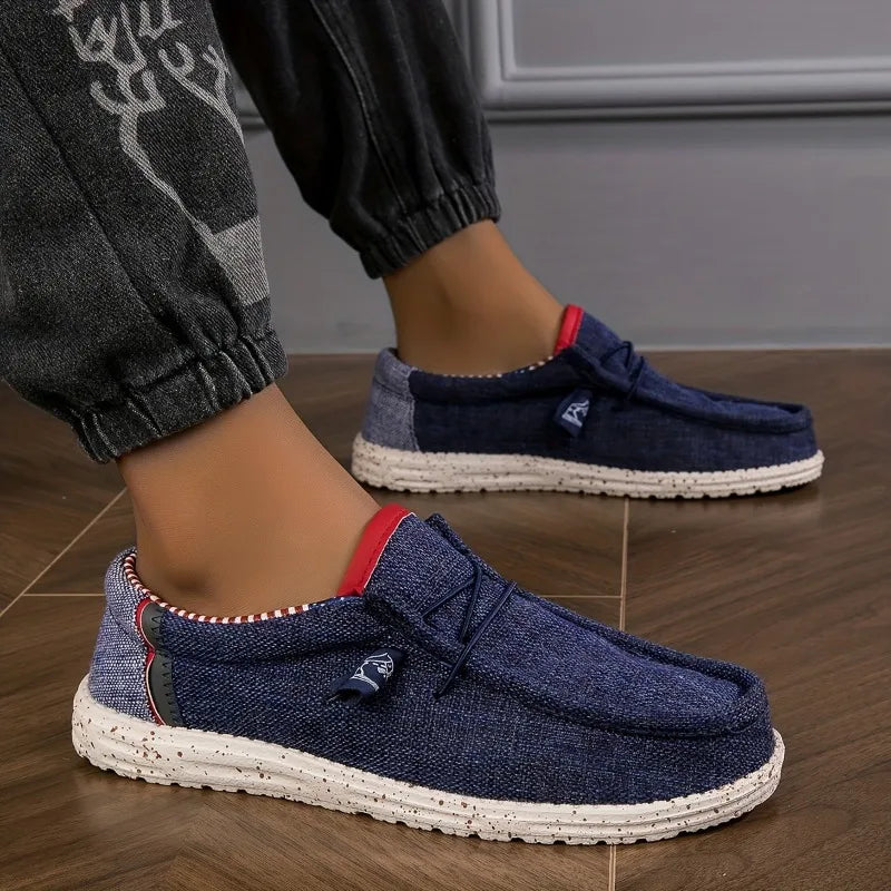 Black men's canvas loafers with a sleek casual design, breathable and comfortable for walking and driving, vulcanized sole.
