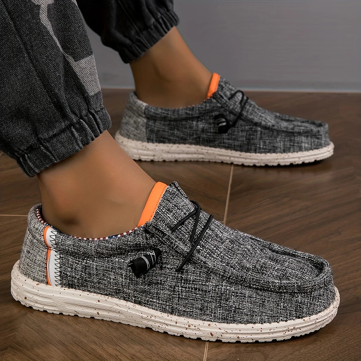 Black men's canvas loafers, breathable casual driving shoes with vulcanized flat soles, designed for comfort and walking.