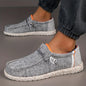 Black men's canvas loafers by BackupMyFilesNow.com, breathable casual shoes with a vulcanized sole, ideal for walking and driving.