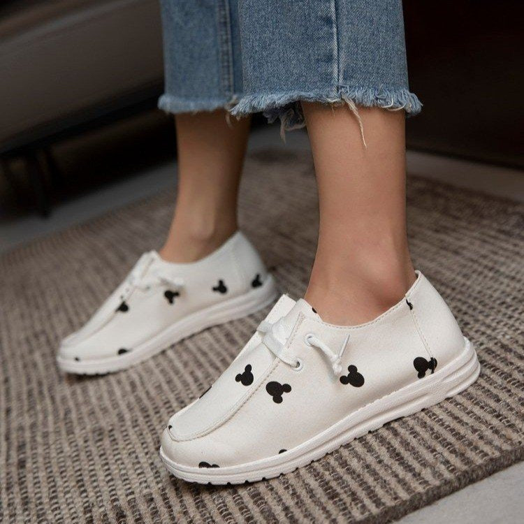 Summer canvas women's lace-up casual flat shoes by BACKUPMYFILESNOW.COM® with white laces and light blue fabric, displayed on a white background.