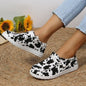 Summer canvas women's lace-up casual flat shoes by BACKUPMYFILESNOW.COM®, showing the light-colored canvas material and flat sole.