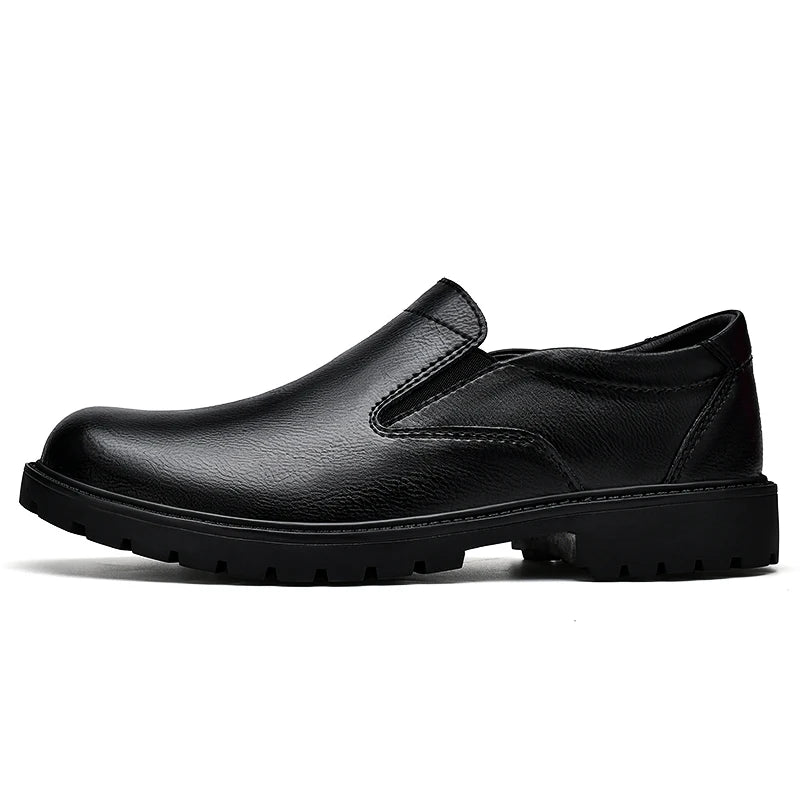 Black men's slip-on oxford loafers made of smooth leather, casual Italian shoes with a sleek, pure color design.