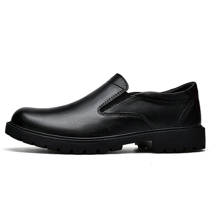 Black men's slip-on oxford loafers made of smooth leather, casual Italian shoes with a sleek, pure color design.
