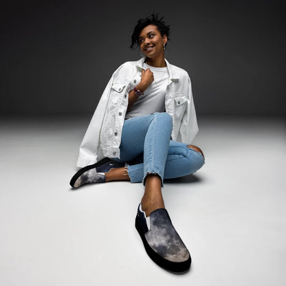 Black women's slip-on canvas shoes by BACKUPMYFILESNOW.COM® with white soles and minimal design, perfect for casual wear.