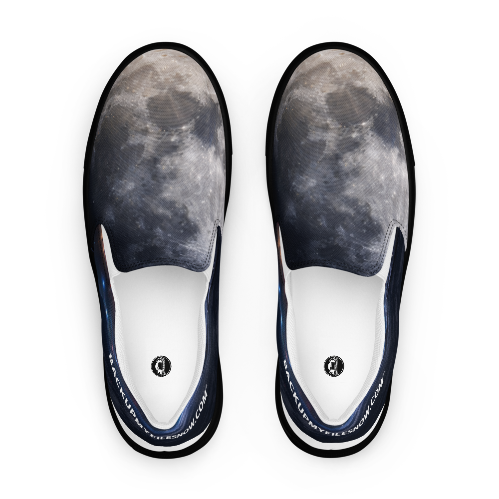 Black women's slip-on canvas shoes by BACKUPMYFILESNOW.COM® featuring a casual, comfortable design with a rounded toe and flat sole.