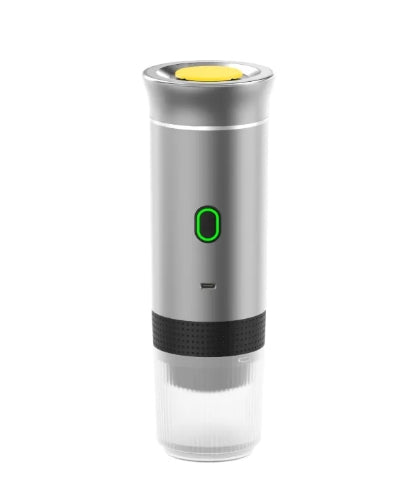 Black portable coffee machine from BACKUPMYFILESNOW.COM® with compact design and brewing components visible.