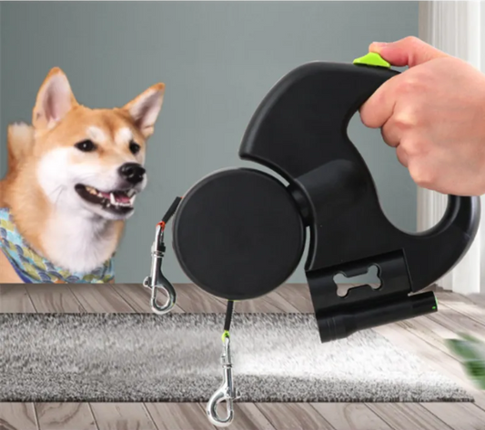 Black auto double dog leash from BackupMyFilesNow.com, designed for walking two dogs simultaneously with hands-free convenience.