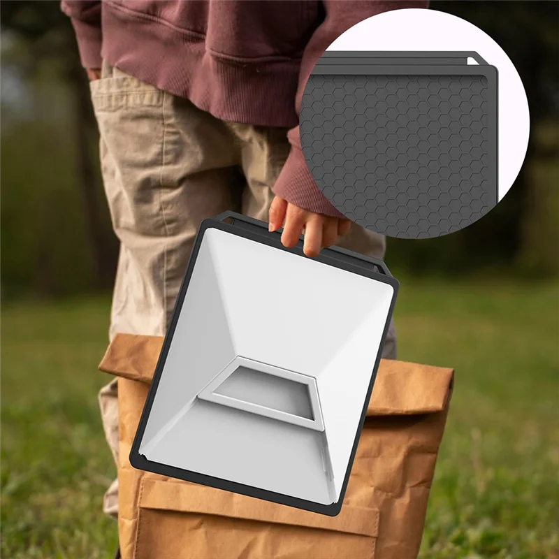 Black silicone protective cover with carabiner for Starlink Mini, providing full coverage and outdoor portability.