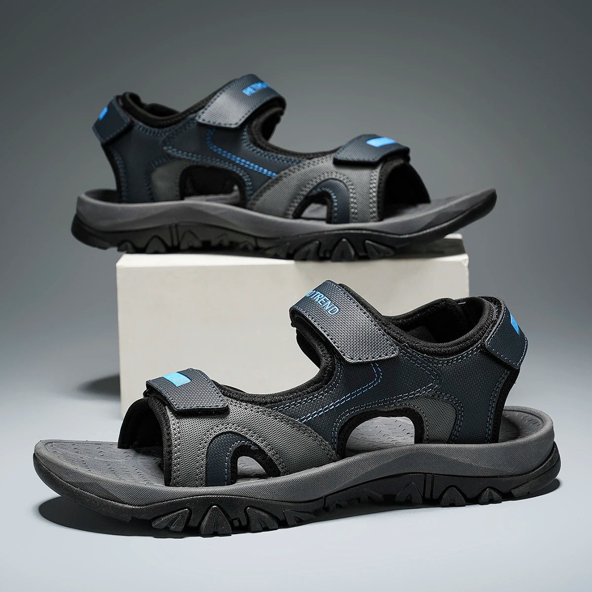 Black and blue men's summer beach sandals with breathable quick-drying material, flat bottom, and non-slip sole for comfortable walking.