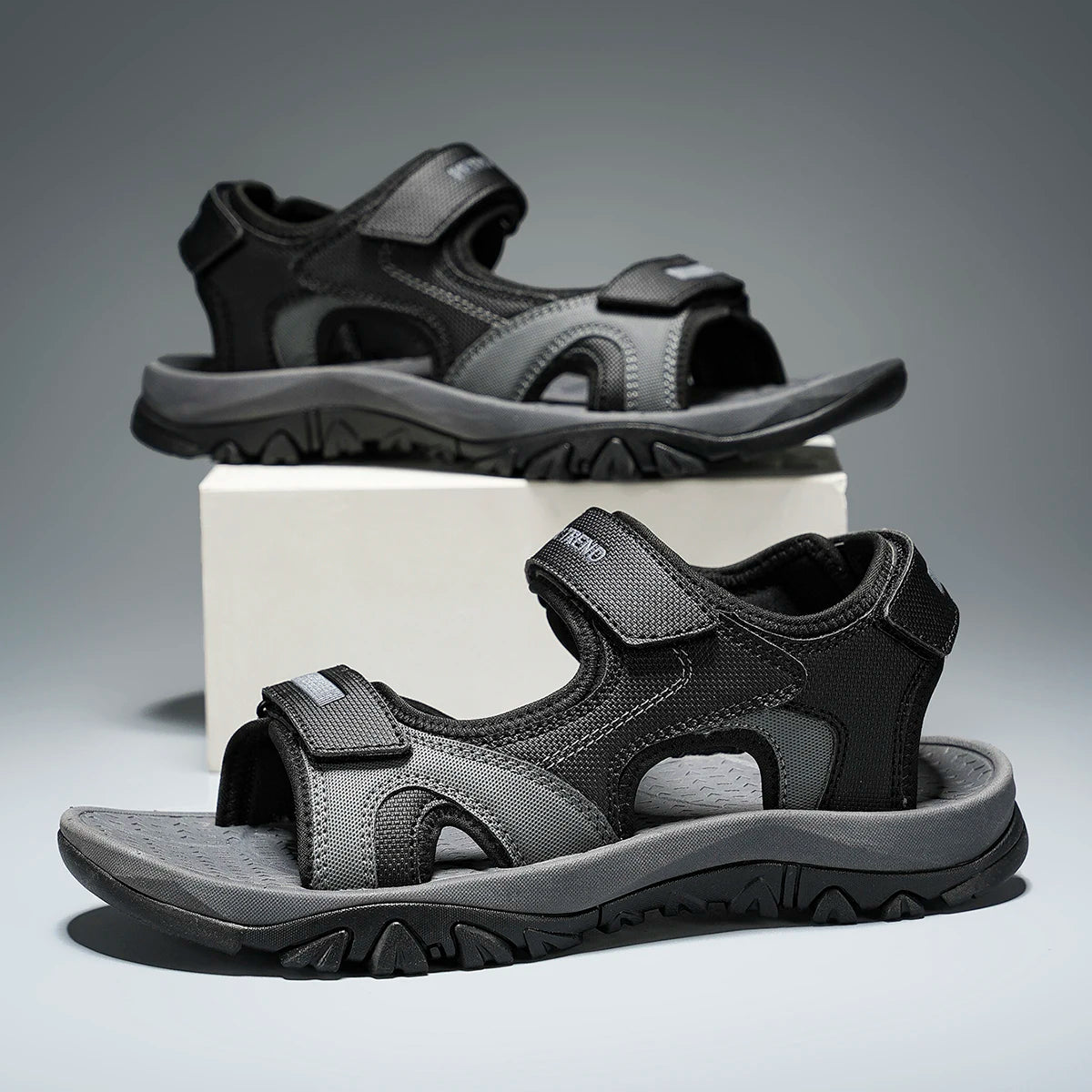 Black and blue men's summer water sandals with breathable, quick-drying materials, flat bottom, and non-slip soles for beach and driving.