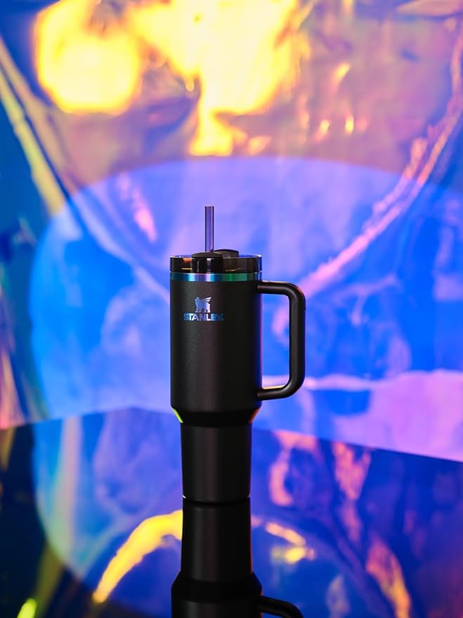 Black Stanley Quencher H2.0 FlowState stainless steel tumbler with lid and straw, ideal for water, iced tea, or coffee.