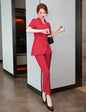 Women's black business formal suit with tailored coat and pants, high-quality design for professional attire.
