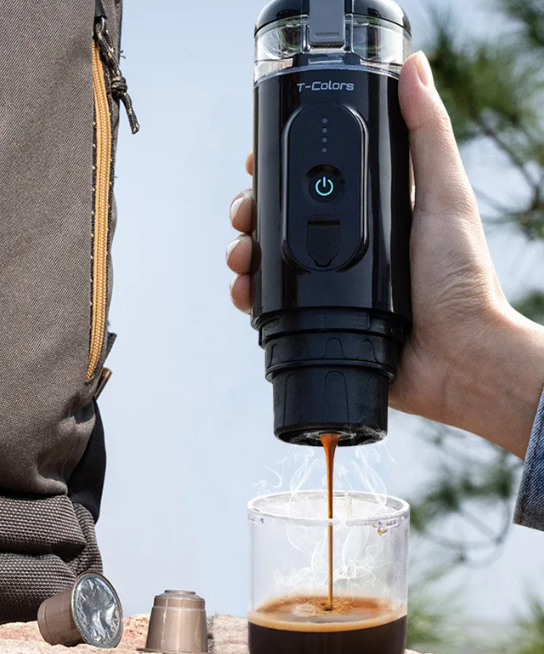 Black coffee maker from BackupMyFilesNow.com with a sleek design, brewing coffee in a modern kitchen setting.
