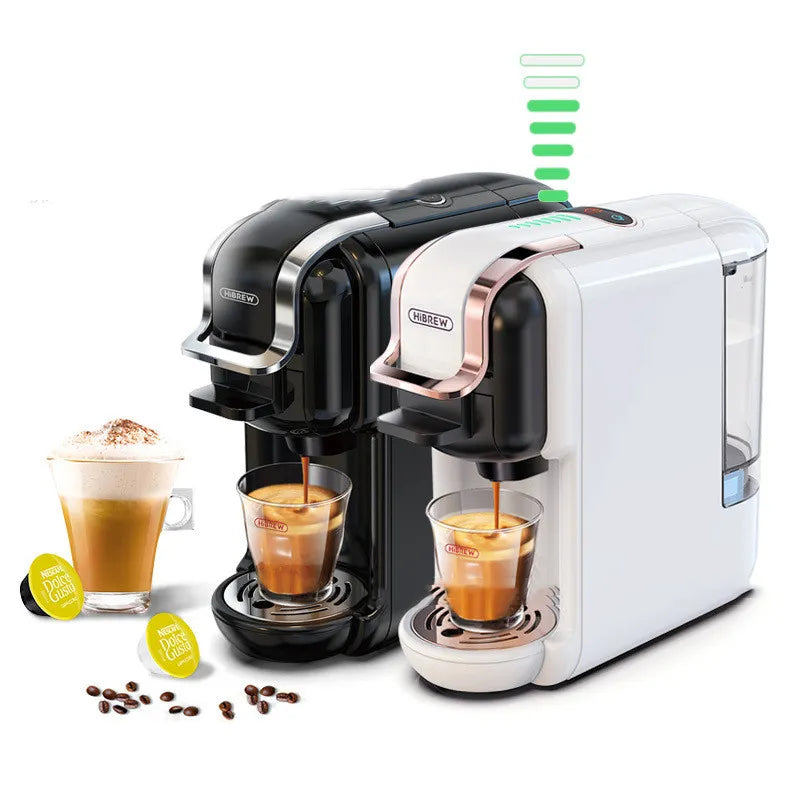 Black BACKUPMYFILESNOW.COM® espresso capsule coffee machine plugged into electrical outlet at home, showcasing a simple fashion design.