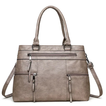 Black elegant women's handbag with top handle, shoulder strap, and spacious tote design made of high-quality PU leather.
