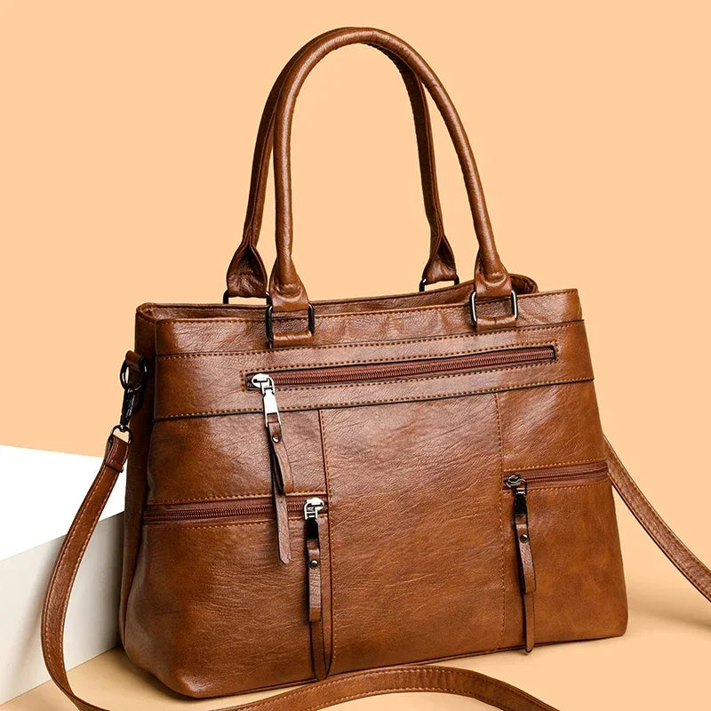 Black elegant women's handbag made of high-quality PU leather with top handle and shoulder strap, casual tote style.