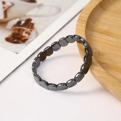 Black hematite bracelet for men with beaded stretch design, showcasing natural hematite stones for confidence and healing.