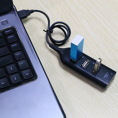 Black 4-port USB 2.0 hub with cable, compact mini splitter for PC, laptop, and notebook, supports power adapter for multiple devices.