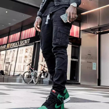 Men's black elastic denim cargo jeans with multi pockets, slim fit, casual style, mid waist, suitable for daily wear.